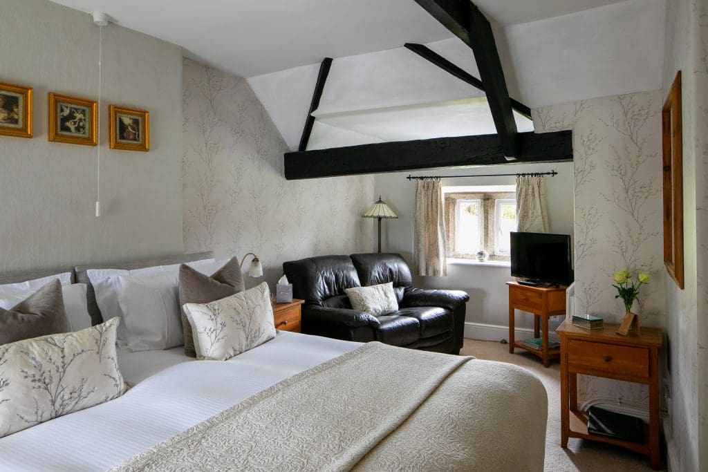 Reddivallen Farm B&B - The Reddivallen Suite - bed, lounge, window, exposed beams